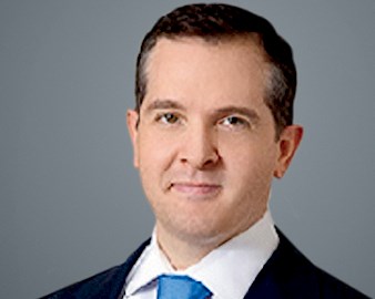 Headshot of Brian Finerty, ’03, CIO, Equity International, Chicago, on a gray background
