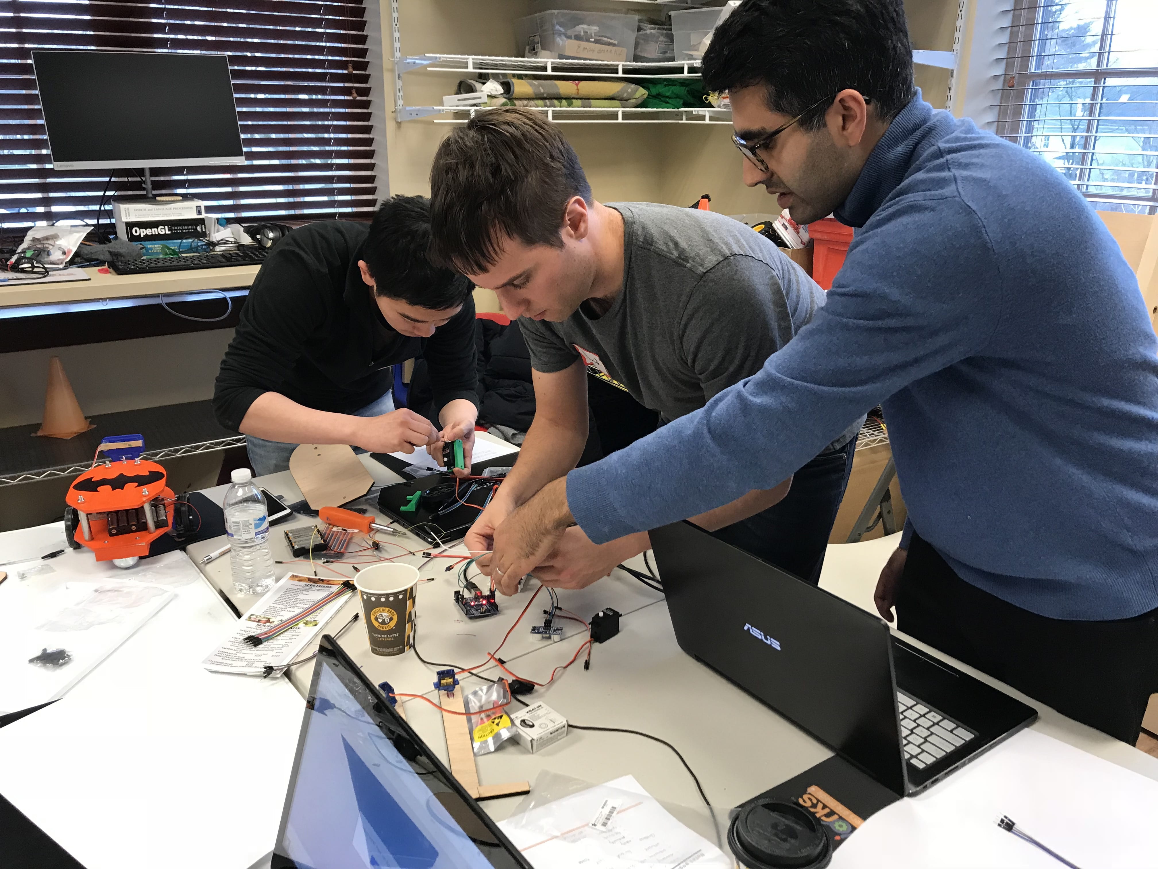 Photo of three students at the TinkRworks workshop