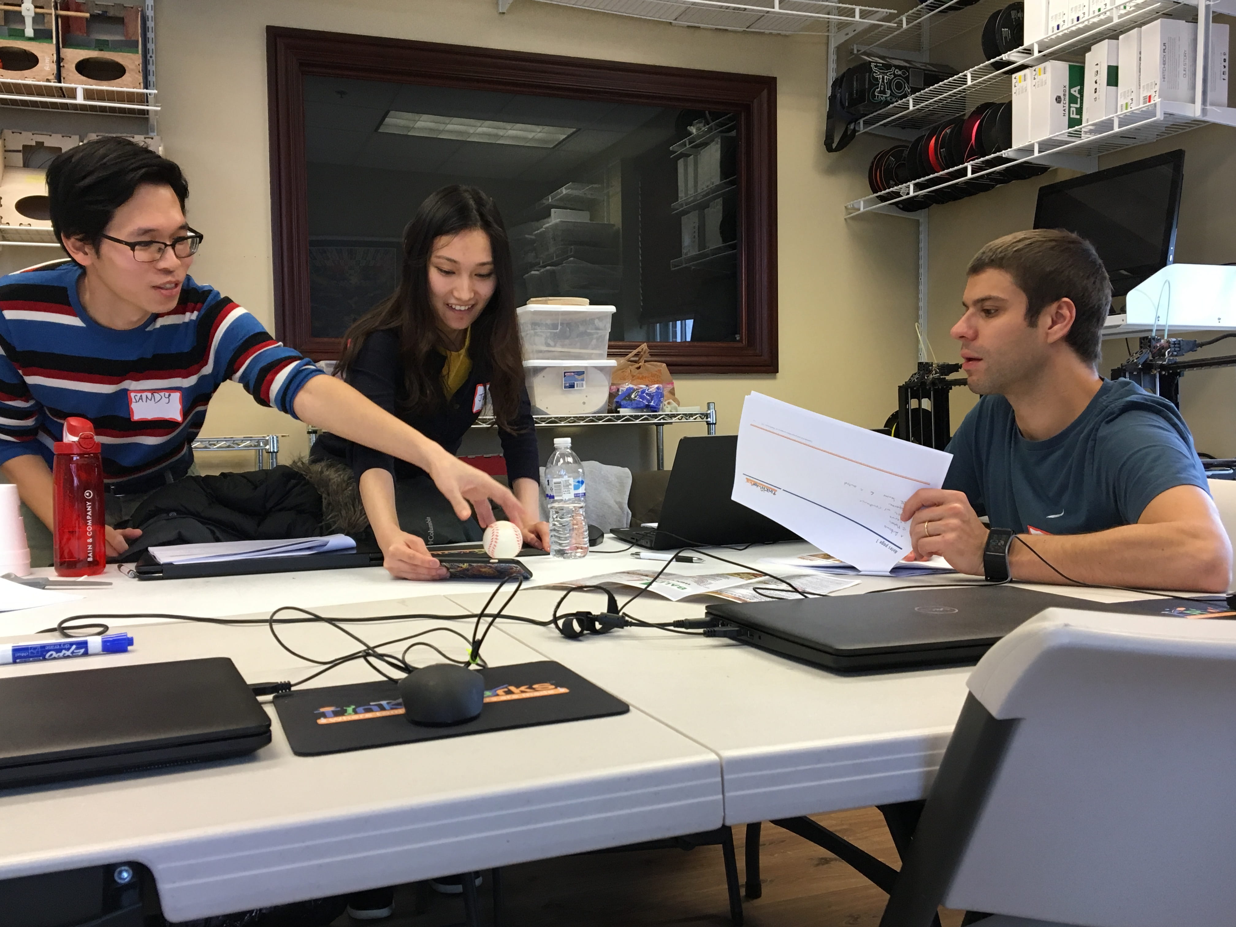 Photo of three students working together at the TinkRworks workshop