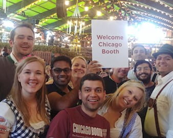 Group of Chicago Booth students dressed in traditional German attire attend Okoberfest in Munich with members of the Chicago Booth Germany Alumni Club.