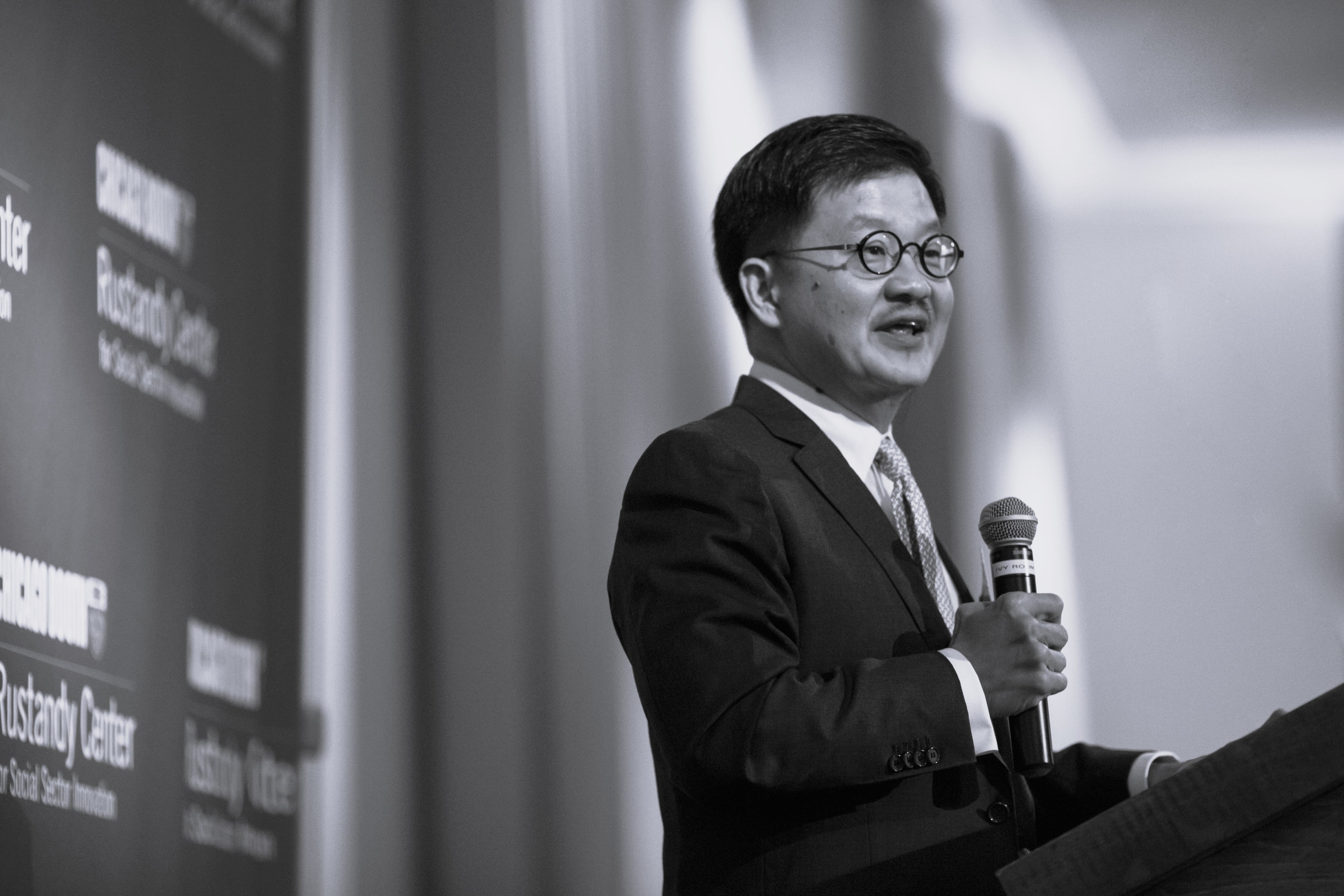 Tandean Rustandy speaking at podium