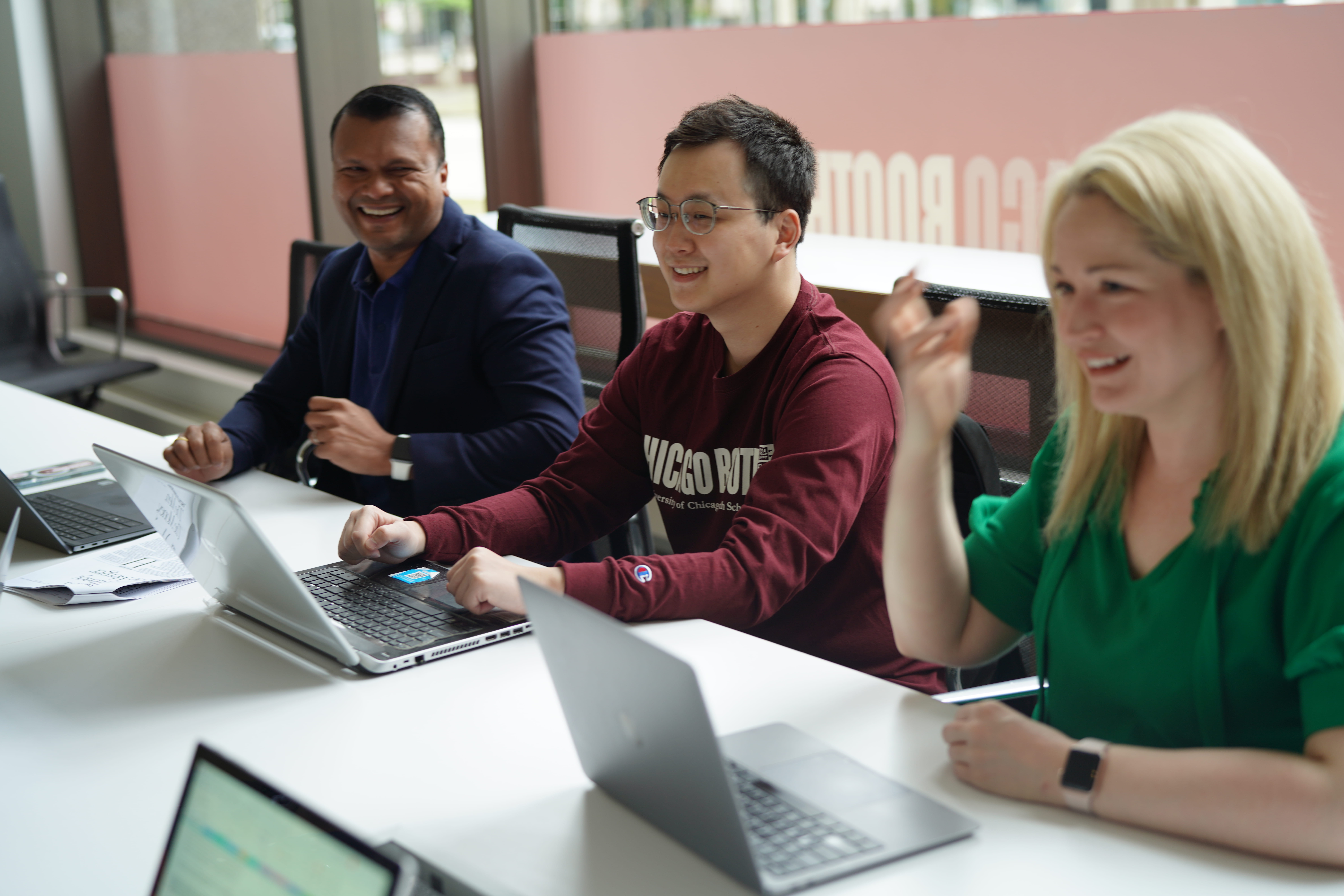 Part-Time students sitting in group with laptops