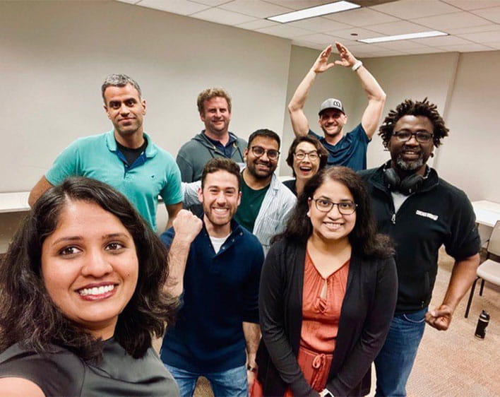 Members of Booth Communications club taking selfie together 