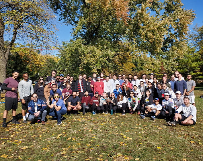 large group of boothies outside in field posing for group picture