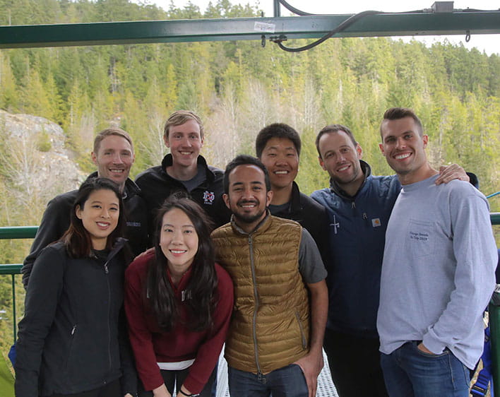 Ritvik with seven Boothies outdoors posing 