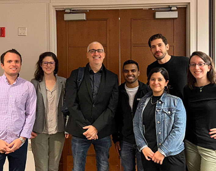 Marketing Club co-chairs posing with Professor Guy Rolnik