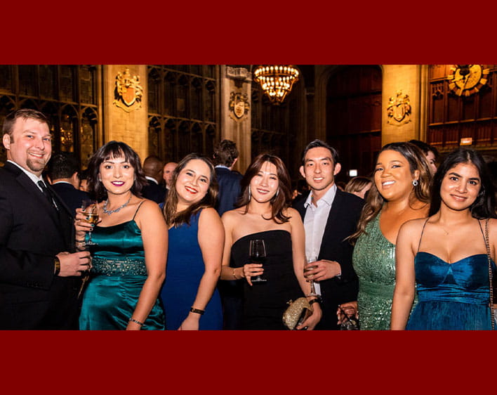 Booth Pride members photographed with dresses and suits 