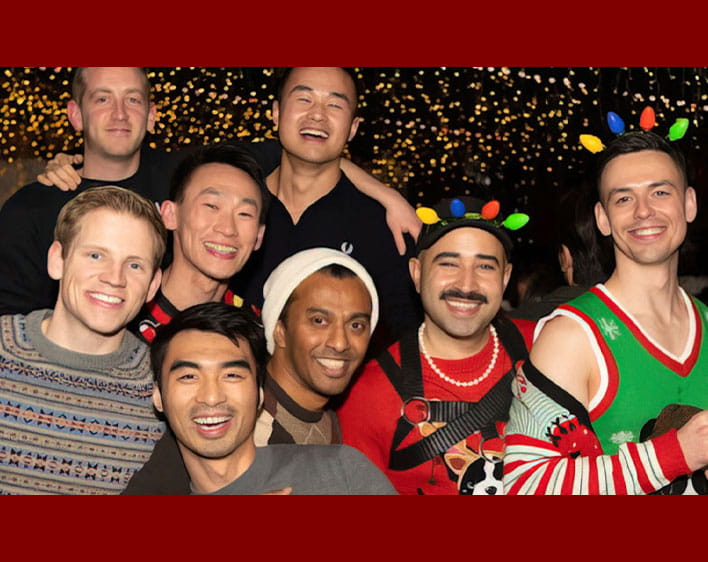 Booth Pride members in holiday clothing 