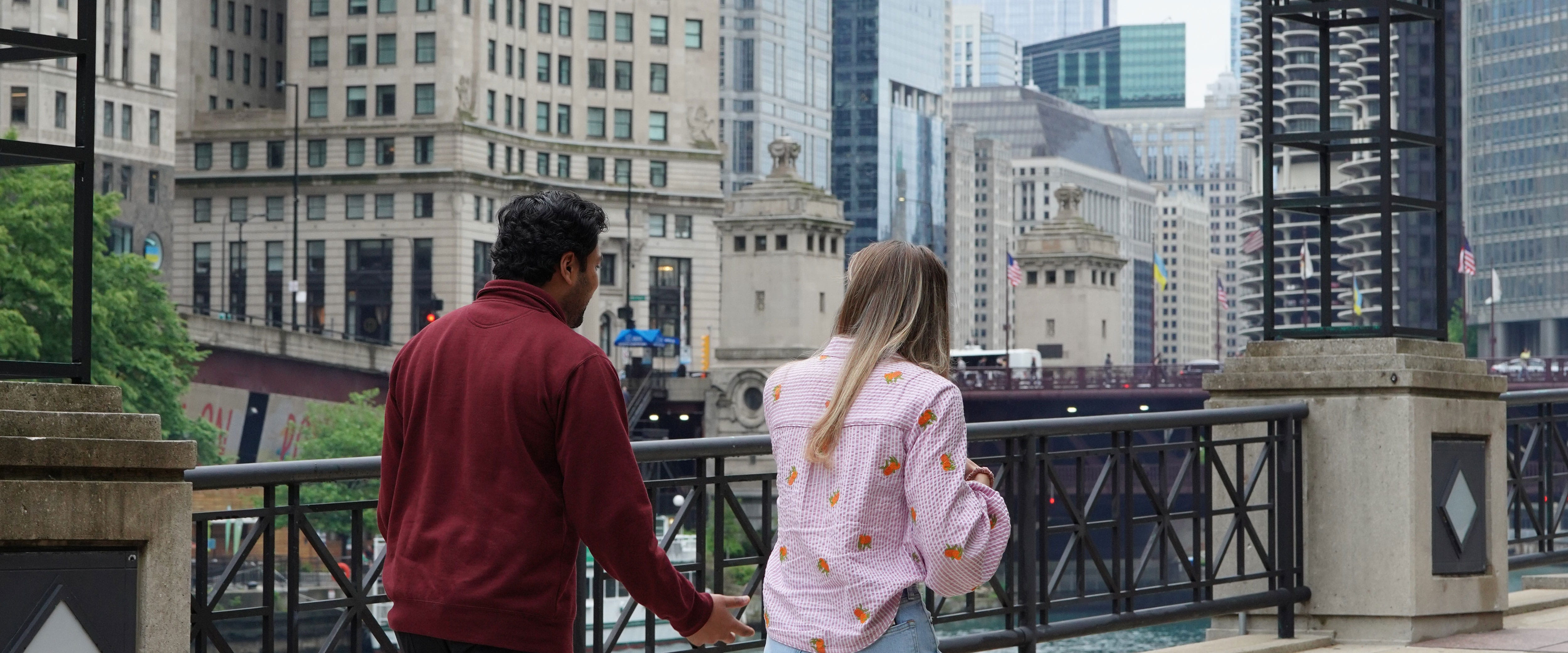 two boothies walking downtown Chicago facing away from camera