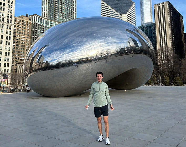 Kyle Balog in front of the Bean