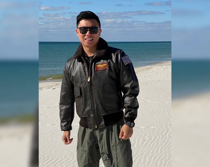 Lawrence in uniform in front of the beach