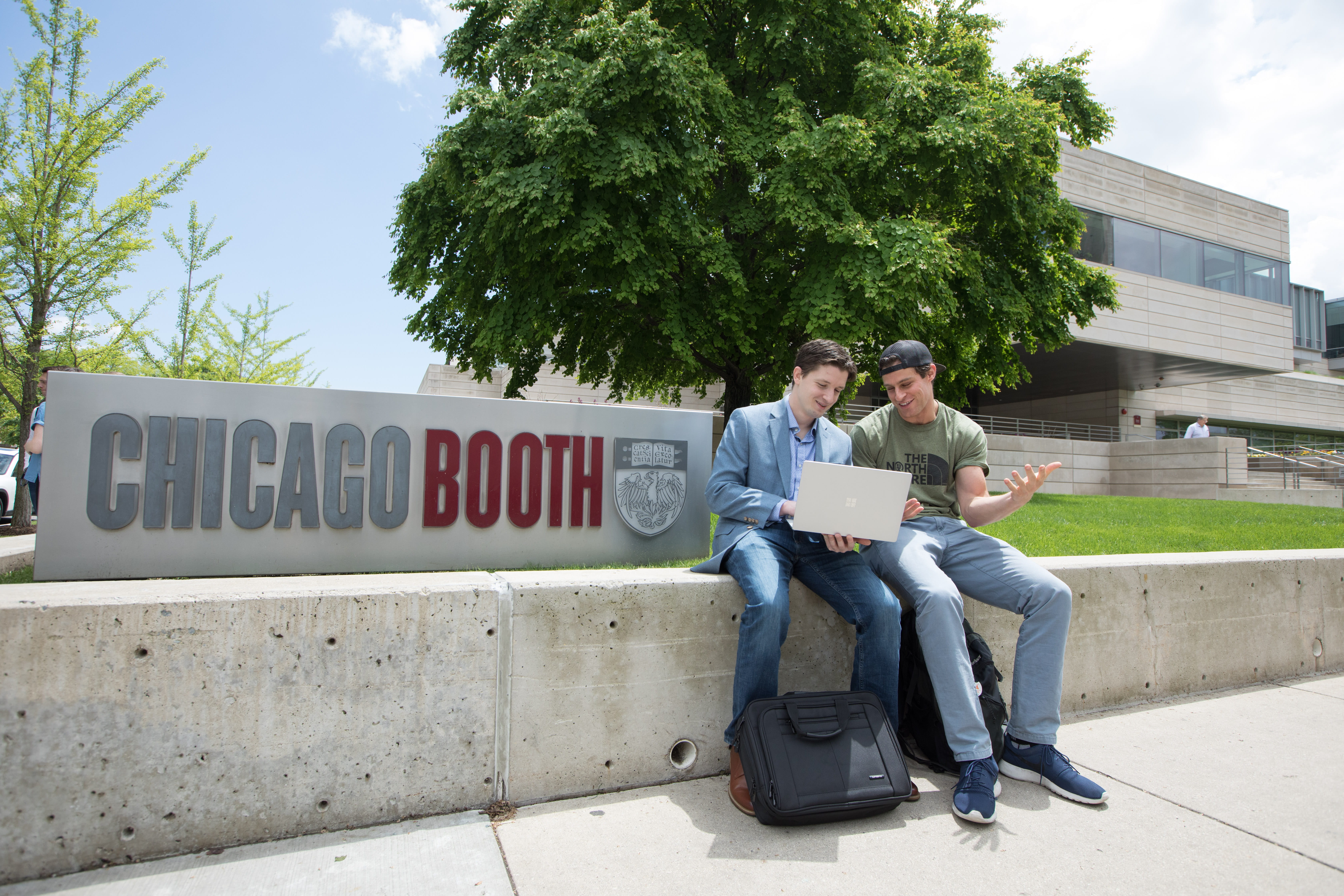 AFG students outside Harper Center conversing 