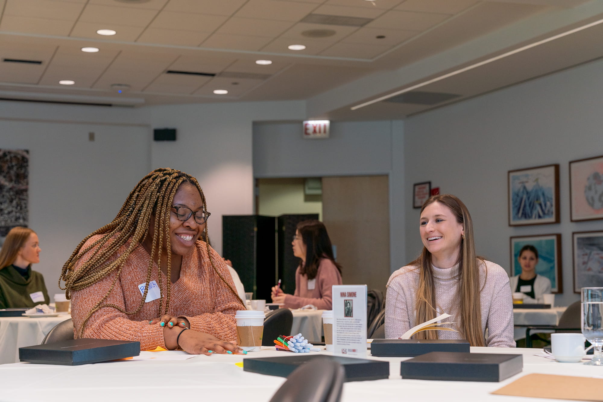 two students smiling Booth Women Advance event 