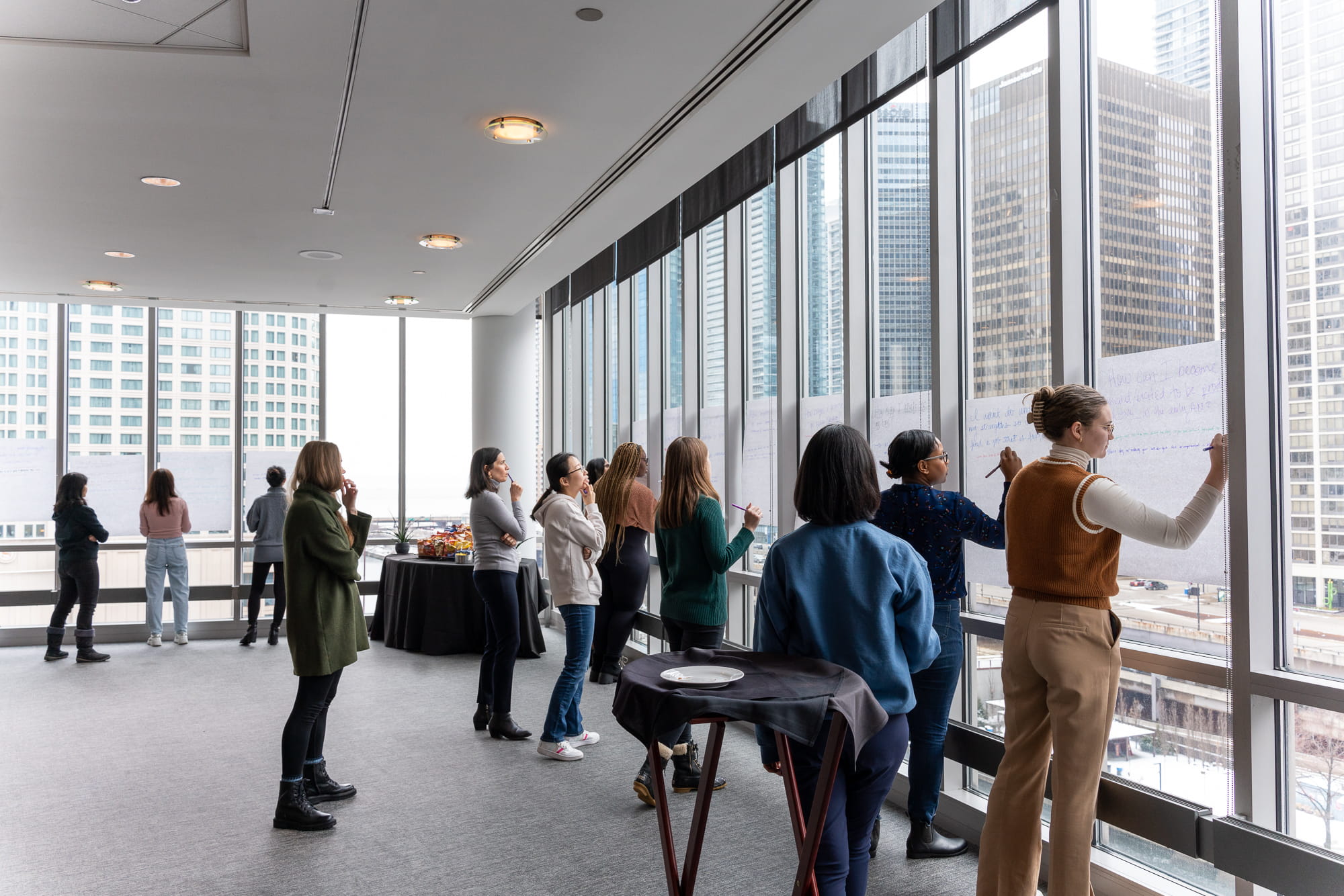students engaging in activity at Booth Women Advance event 