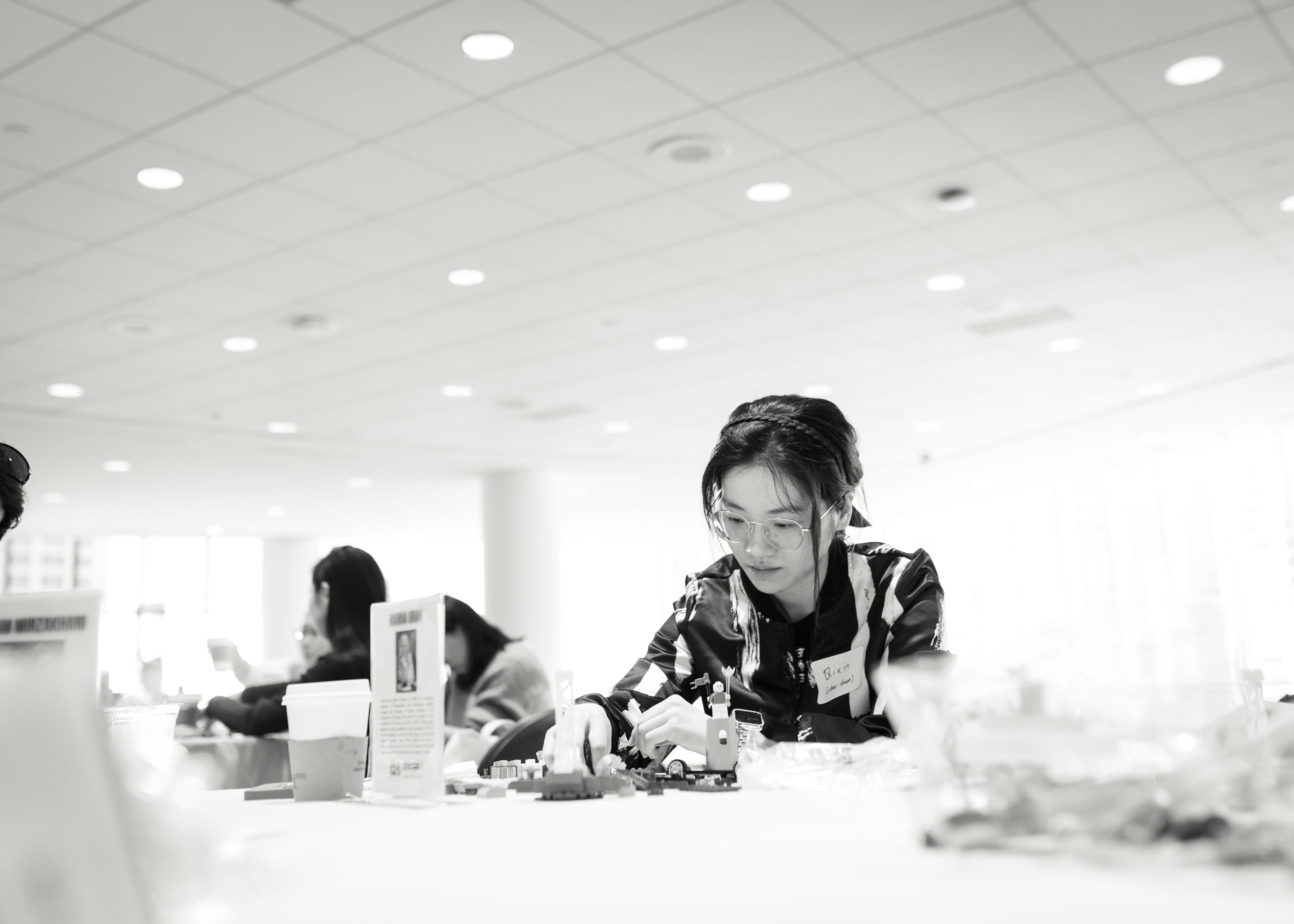 student sitting at Booth Women Advance event