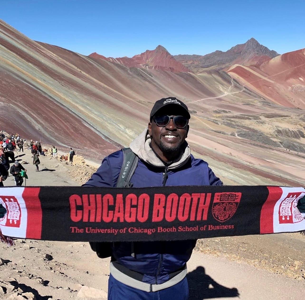 Kwaku Frimpong holding up Booth flag