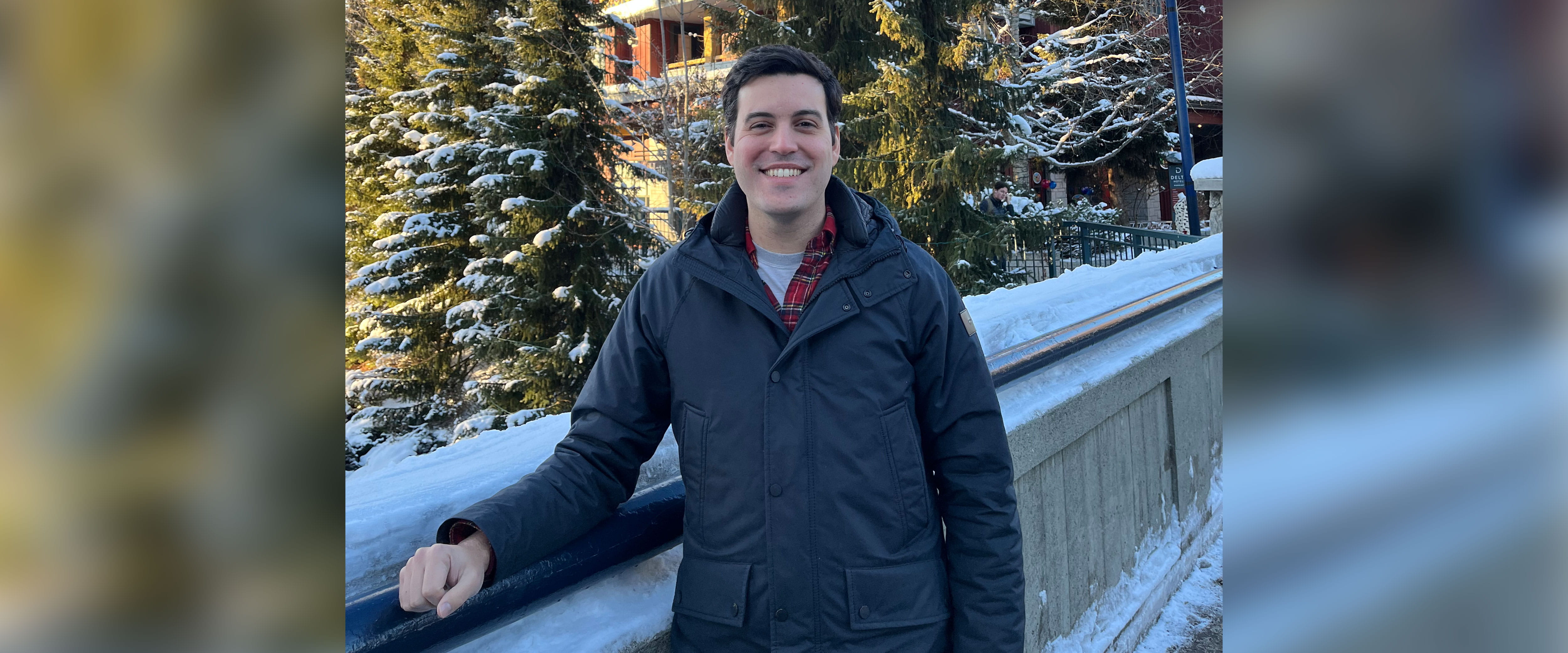 Pedro Ribeiro outside smiling with coat on and snow in the background