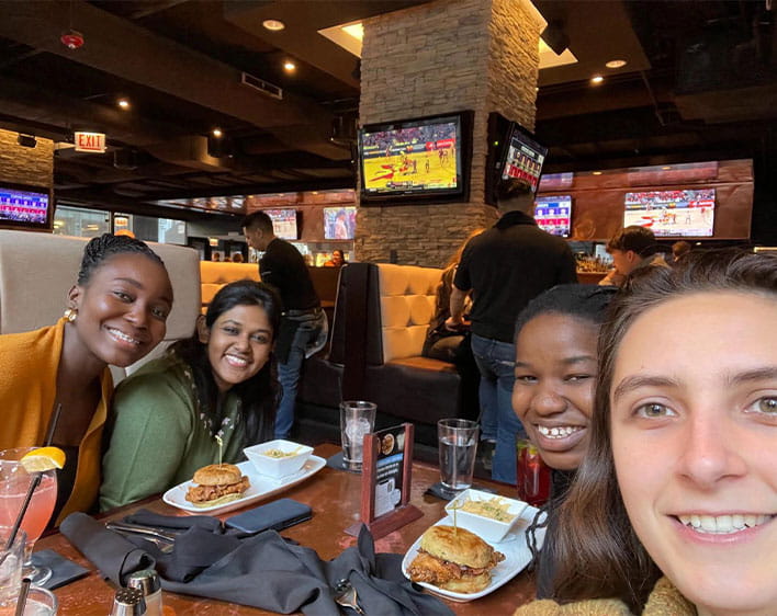 Deya and friends taking selfie while out to eat