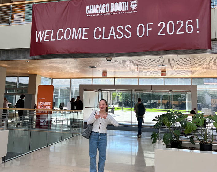 Emma in front of the "Welcome Class of 2026" sign