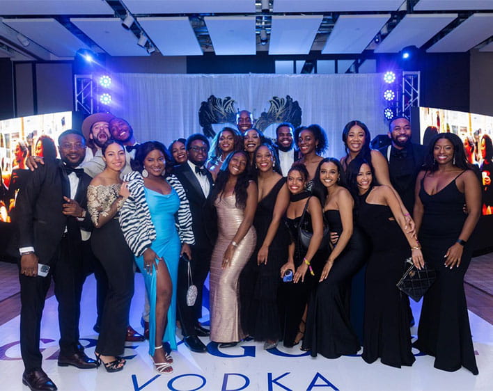 Group photo of Boothies in formal wear at Black Ski Weekend 