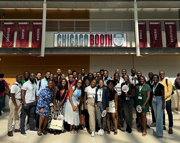 group photo of Boothies in the Winter Garden at the Harper Center
