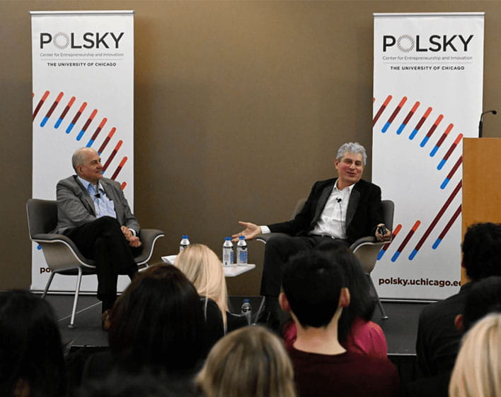 Polsky center event with two speakers and a crowd of people