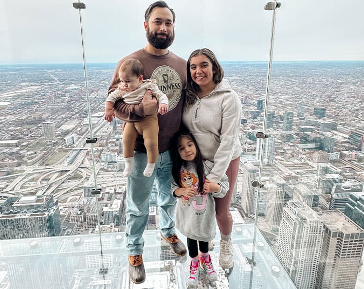Peter downtown Chicago with his wife and two children