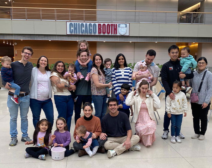 group photo taken in Harper Center Winter Garden of Boothies with their families