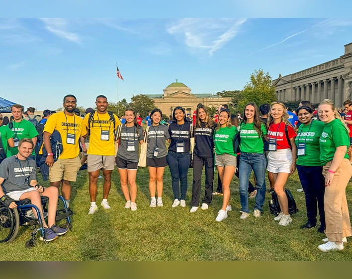 Isha with other Boothies outside in group photo during orientation