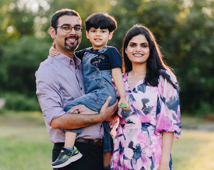 family portrait of Manu Chintapalli with her husband and child
