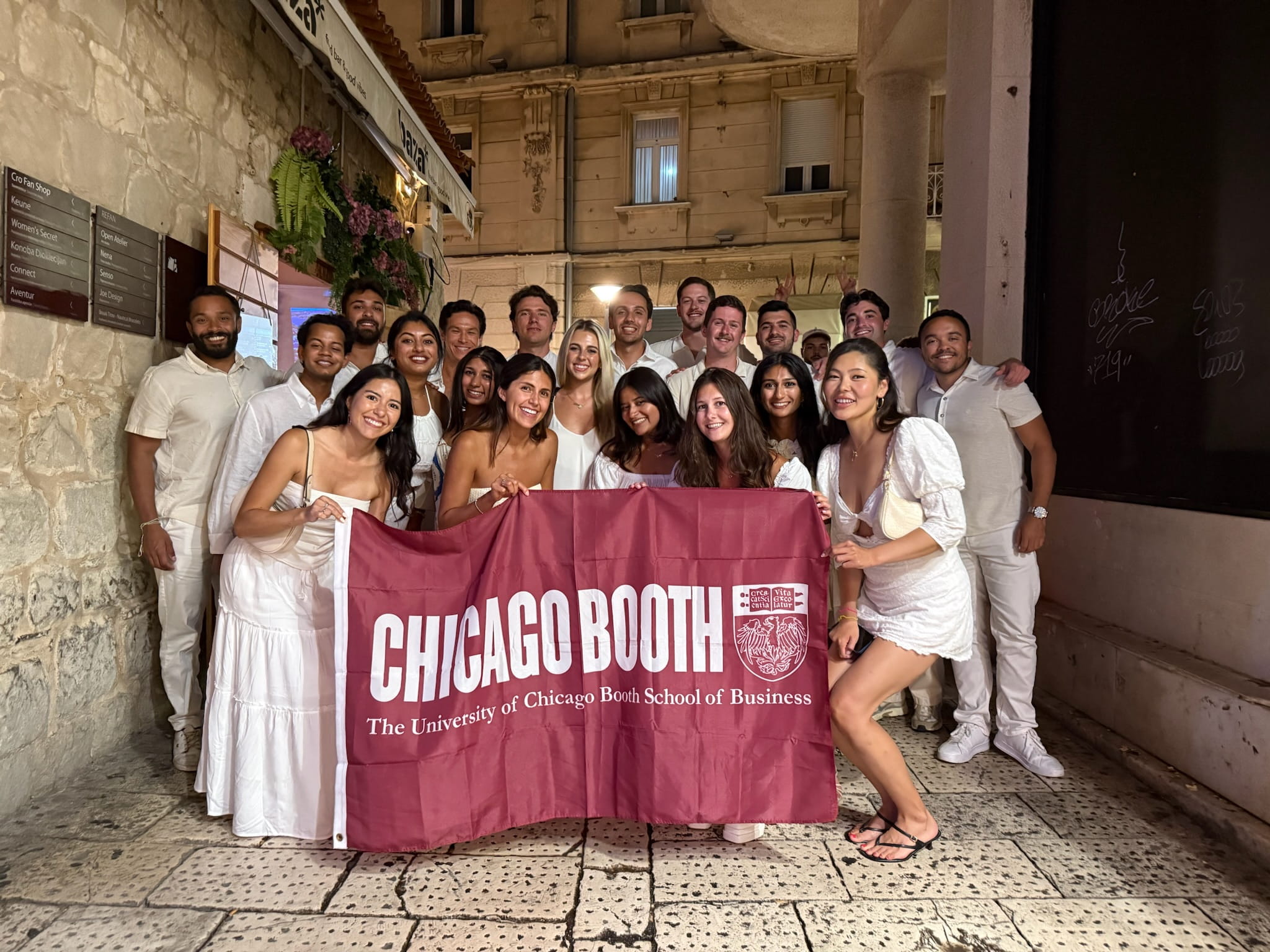 Sai and group of students in all white outfits at Croatia Random Walk Trip