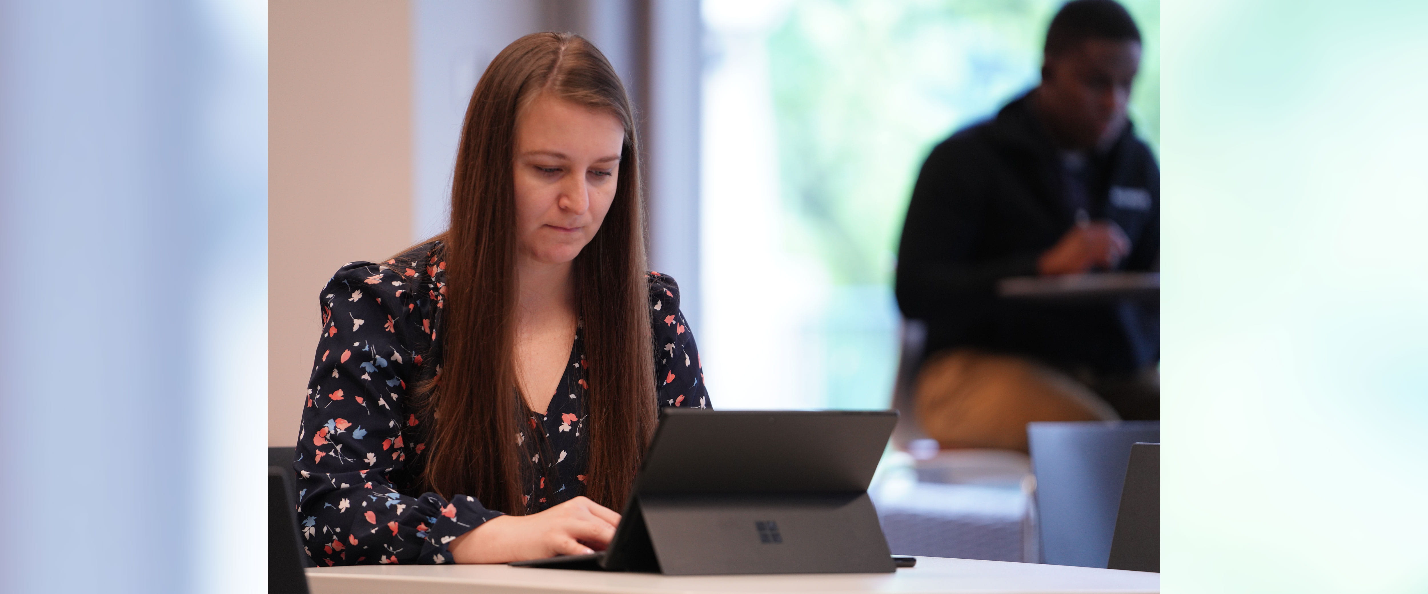 woman sitting down while on computer
