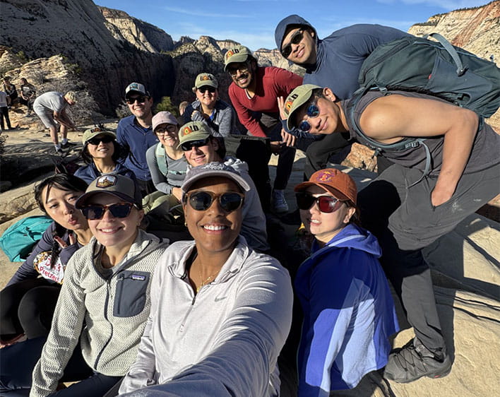 Selfie of Dena and group of Boothies outdoors at Angels Landing