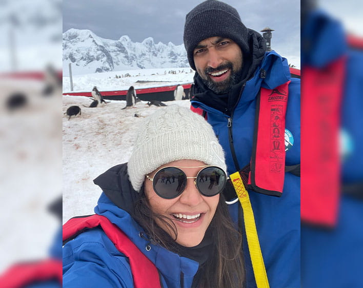 selfie of Anushka and Abhishek outdoors in snowy area with winter gear on