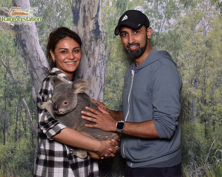 Anushka and Abhishek petting Koala at Rainforestation Nature Park