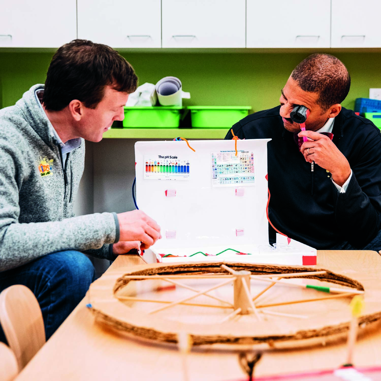 Keith Norsym, '05 and Shegan Campbell, '05 present a kid's science project at Kids Science Labs