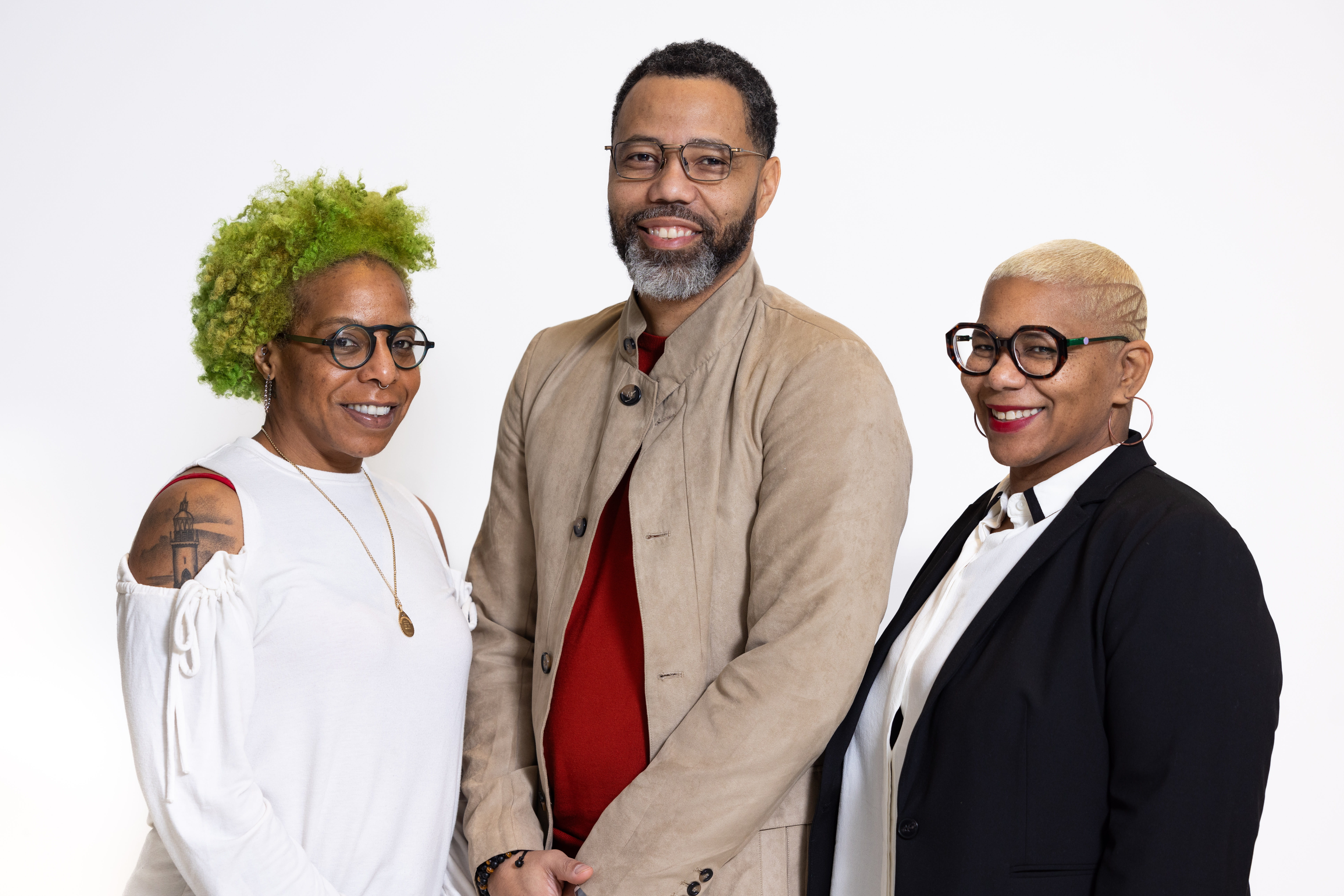 Three people looking at the camera