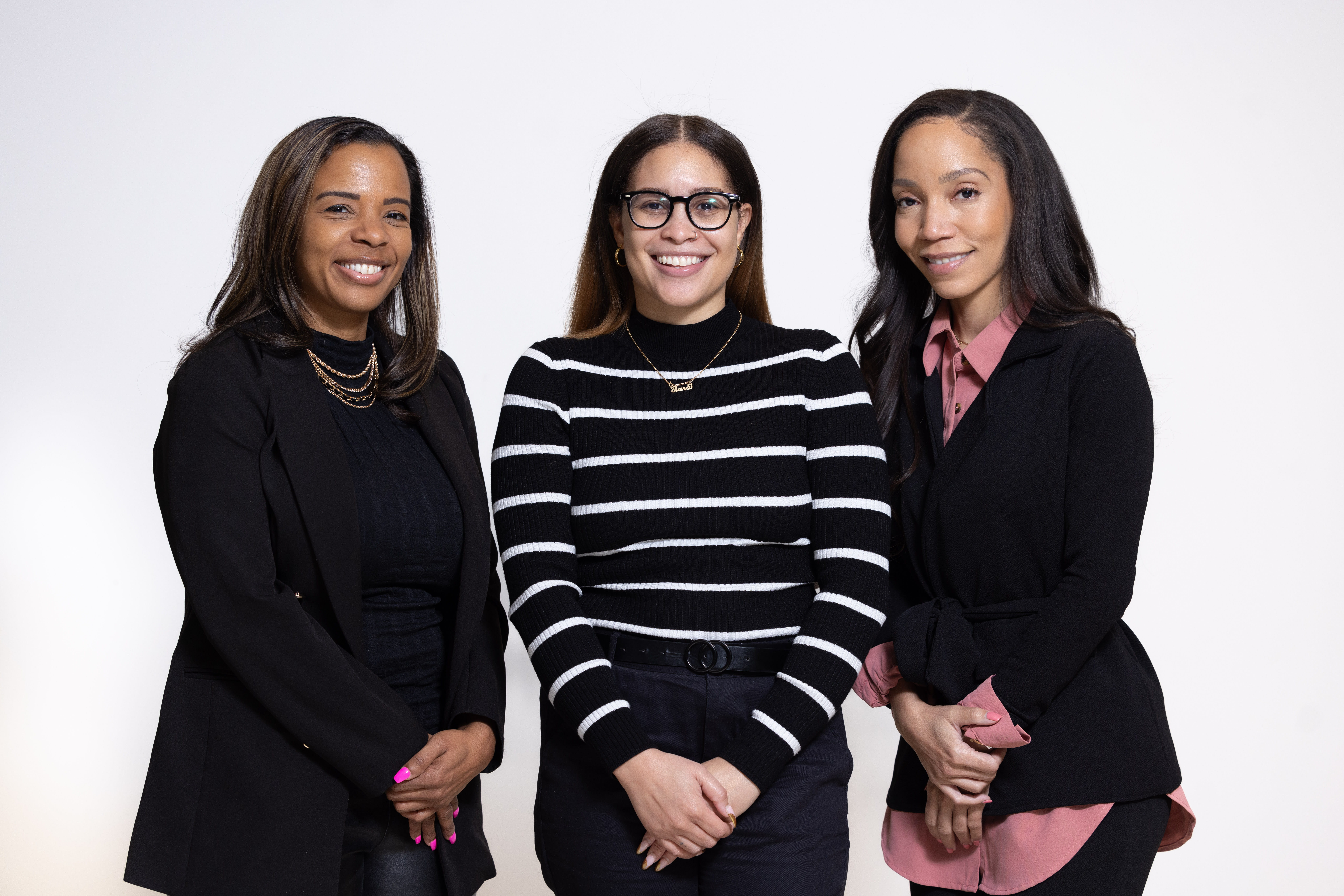 Three women looking at the camera