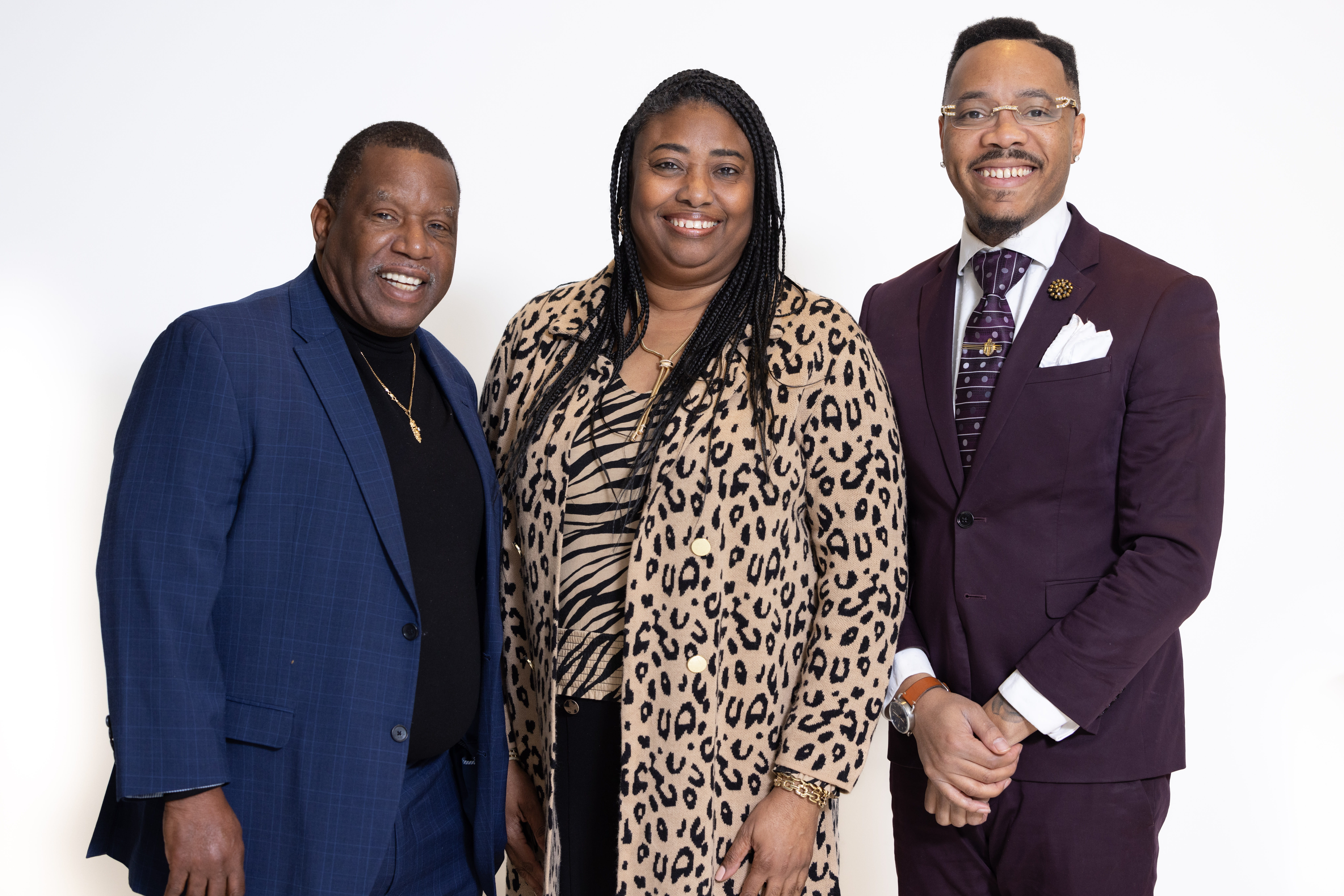 A woman and two men standing together