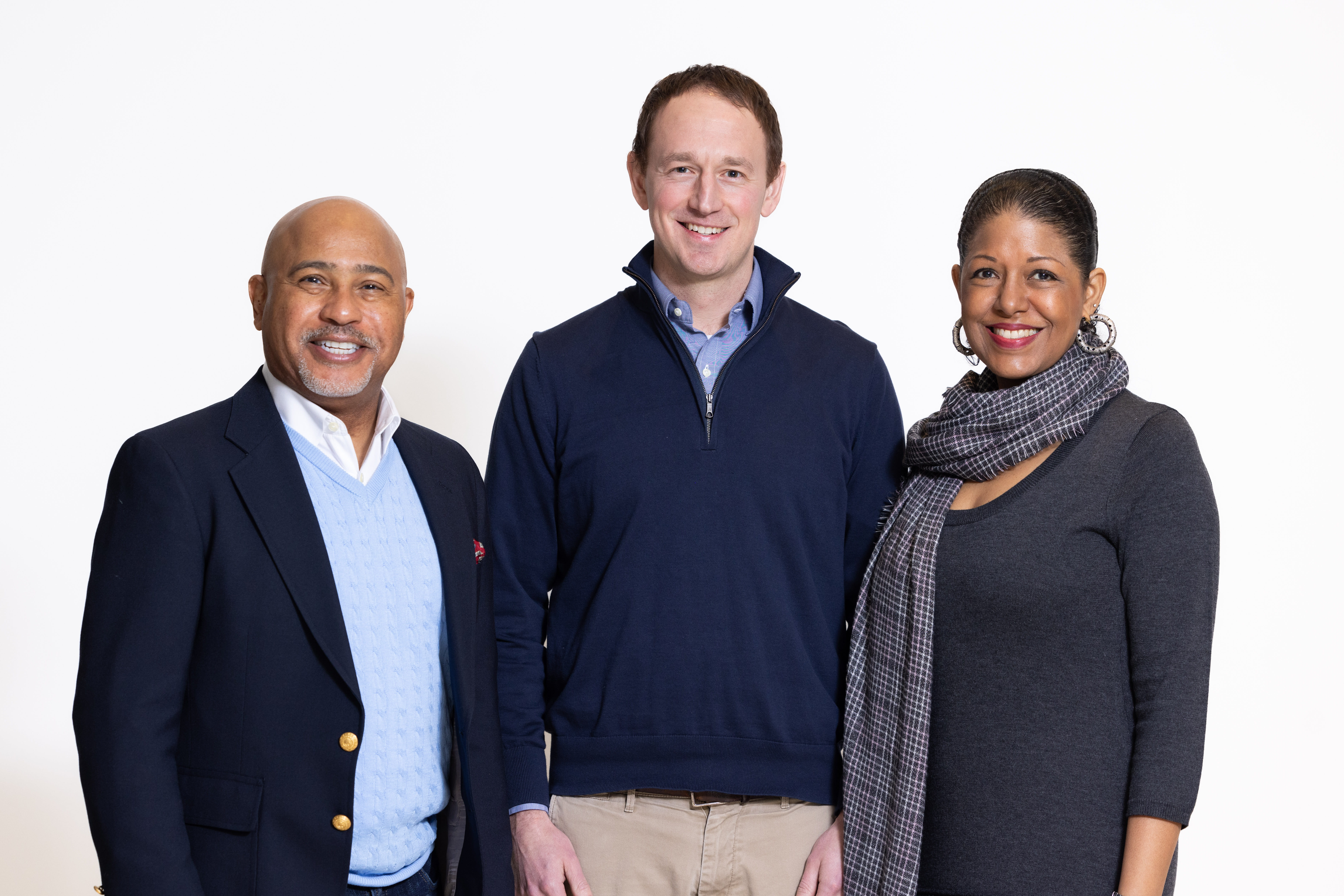 Two men and a woman standing together