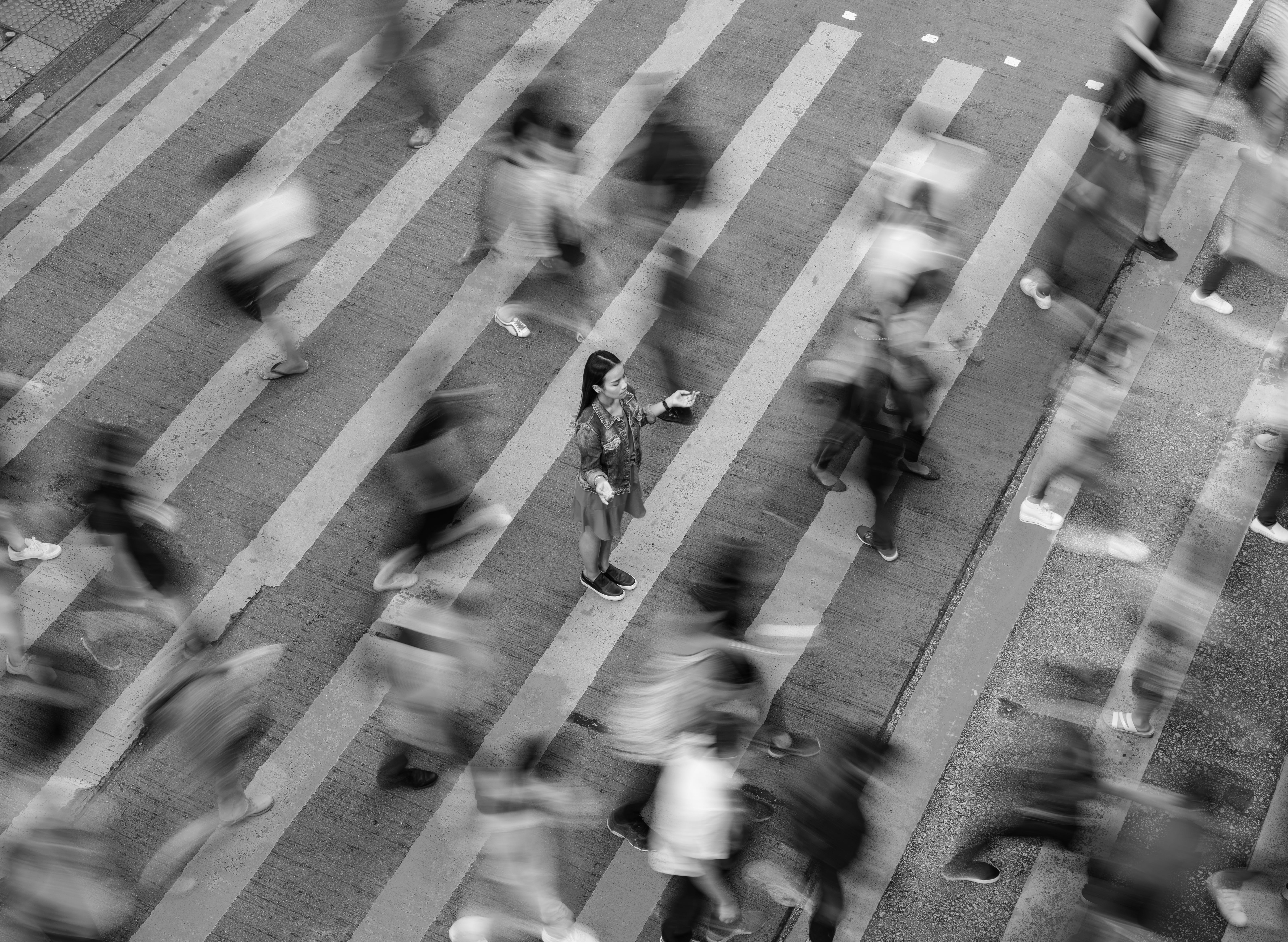 People walking across a crosswalk
