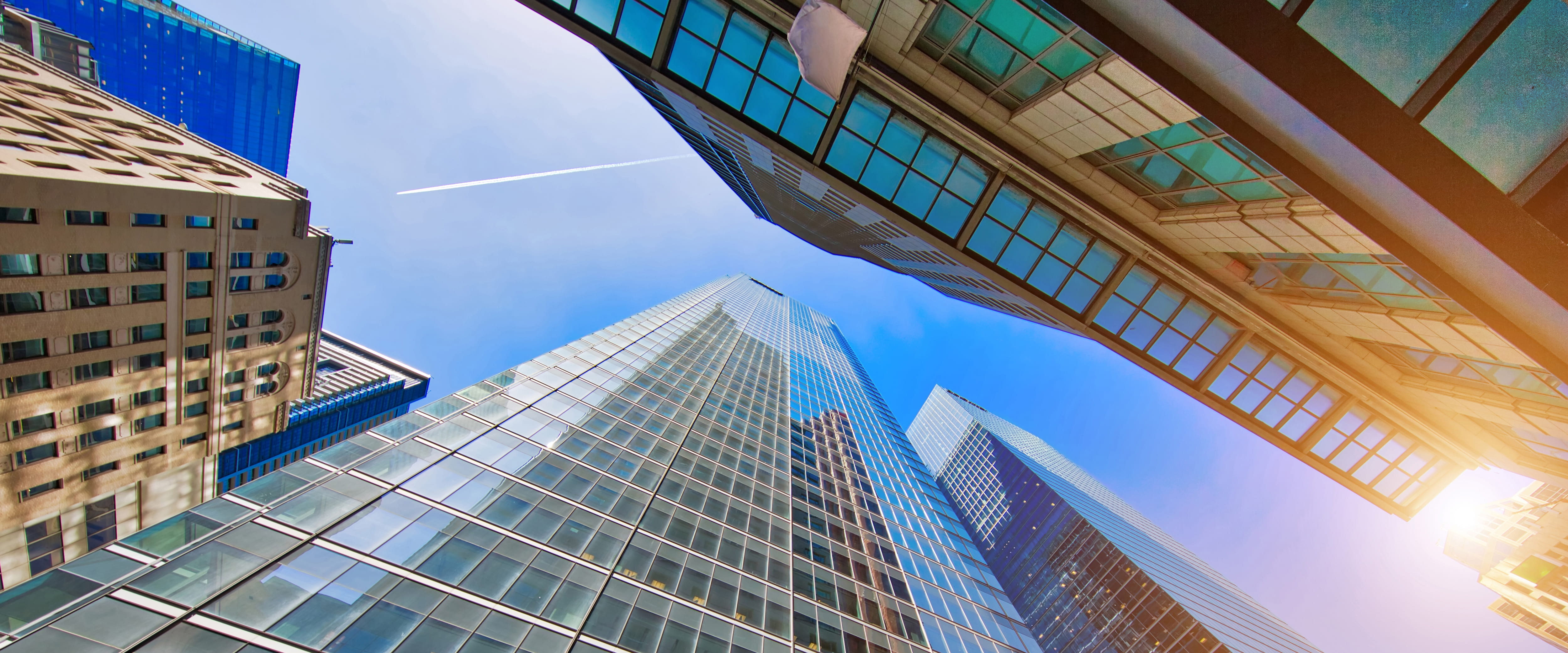  Urban shot of buildings from below looking up toward the sky