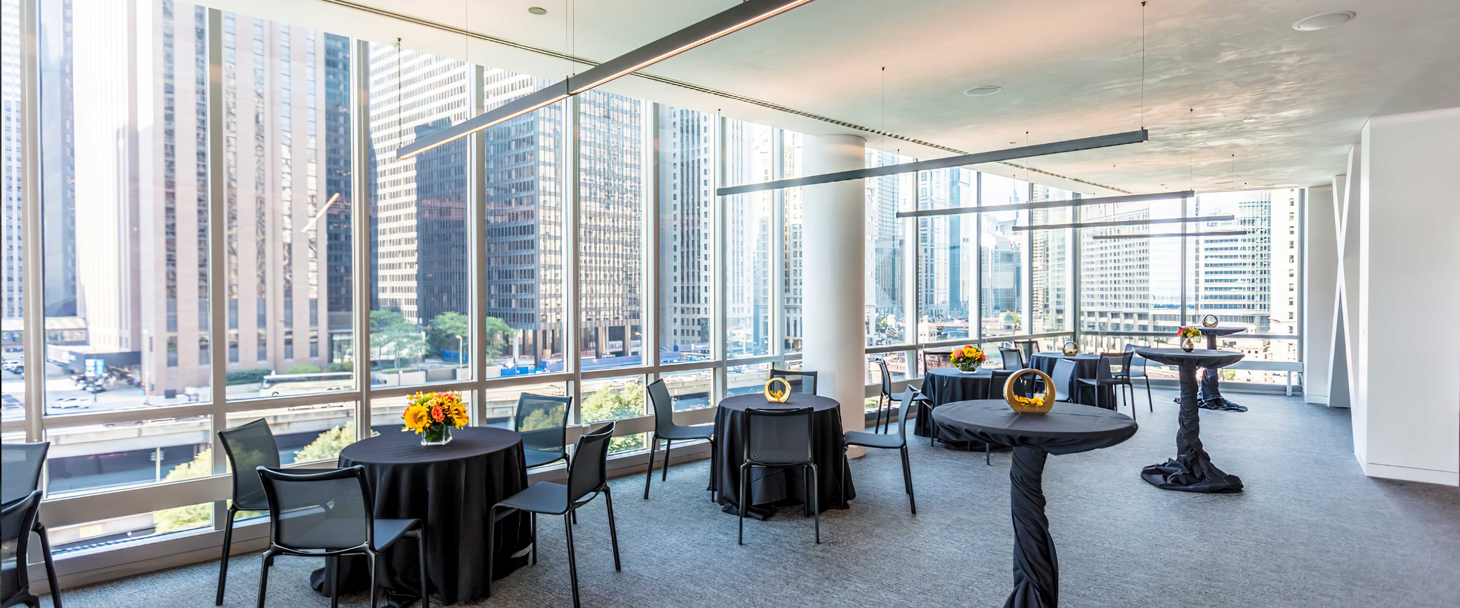 Dinner reception seating at the Gleacher Center overlooking Downtown Chicago 