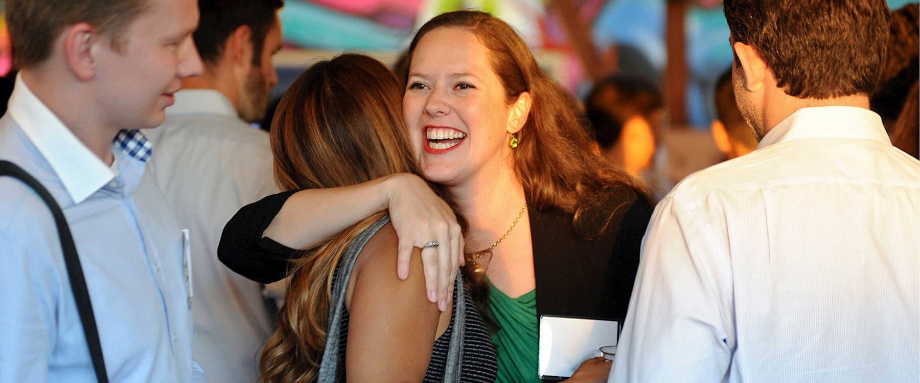 Women hugging at an event