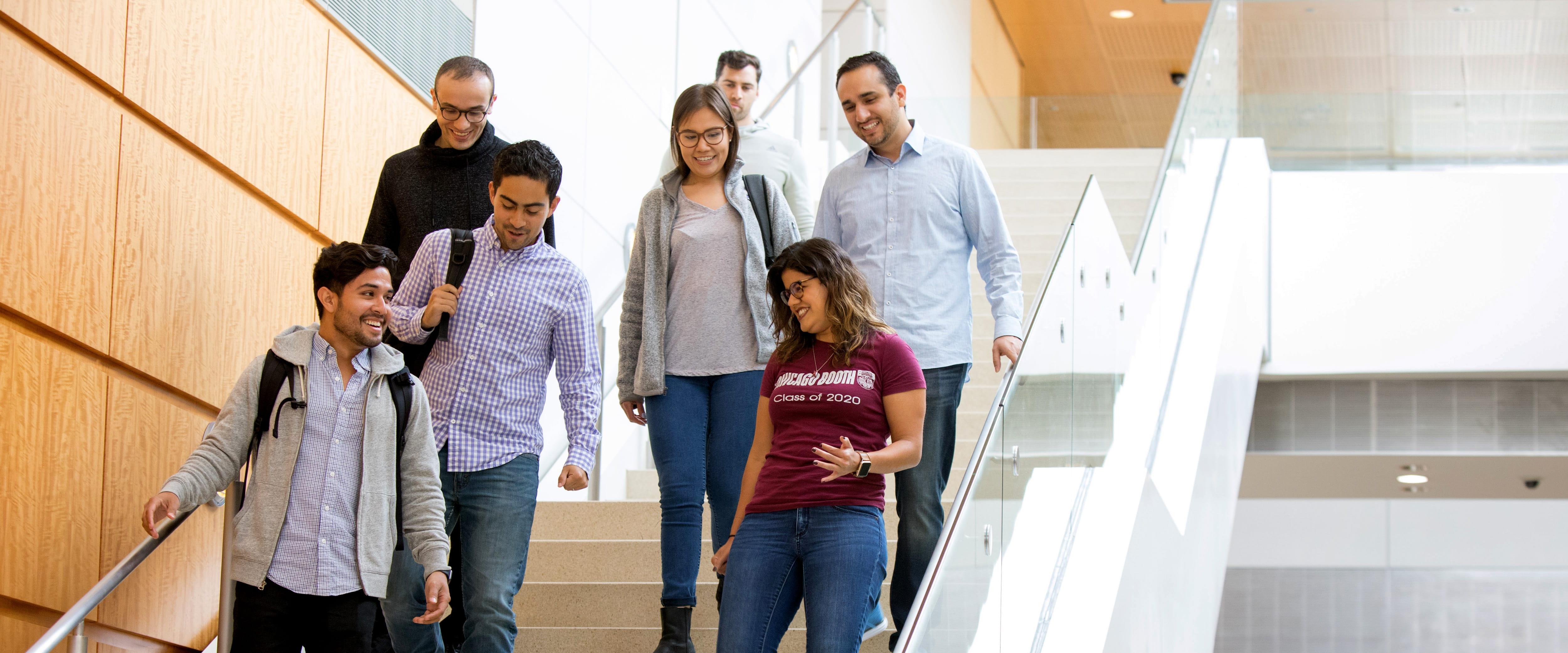 Group of students walking down the stairs in Harper Center
