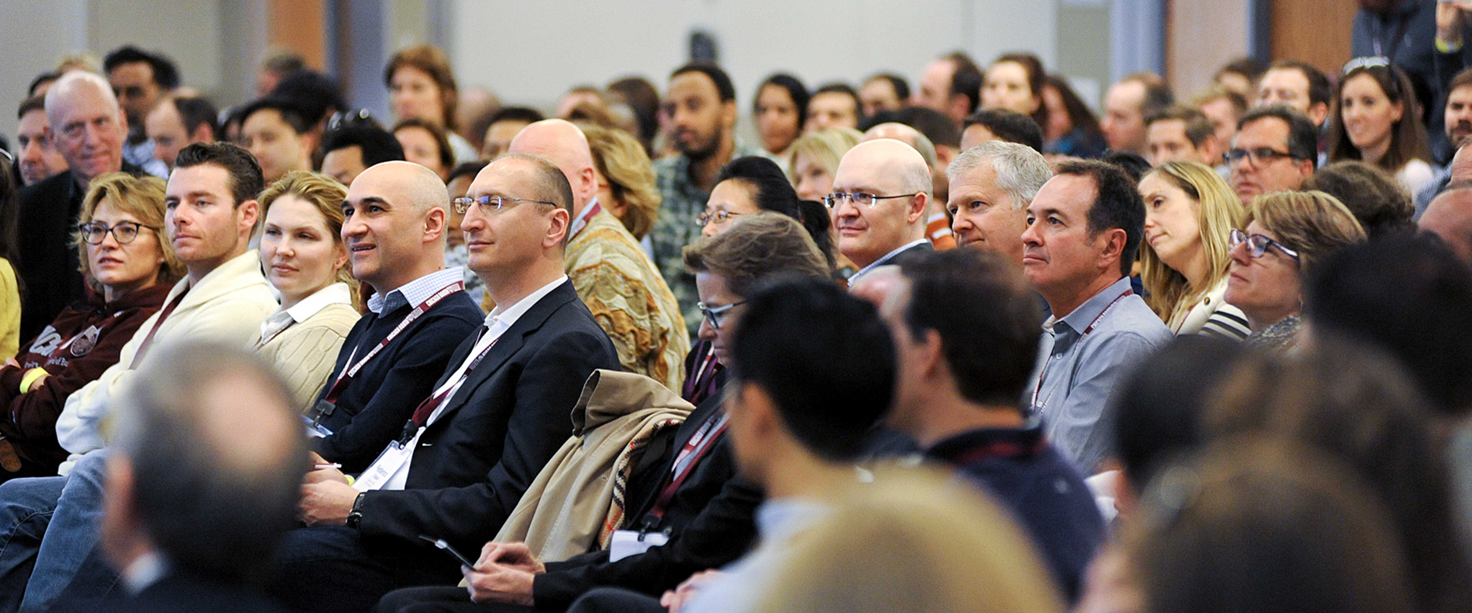 Chicago Booth alumni at an event seated in an audience