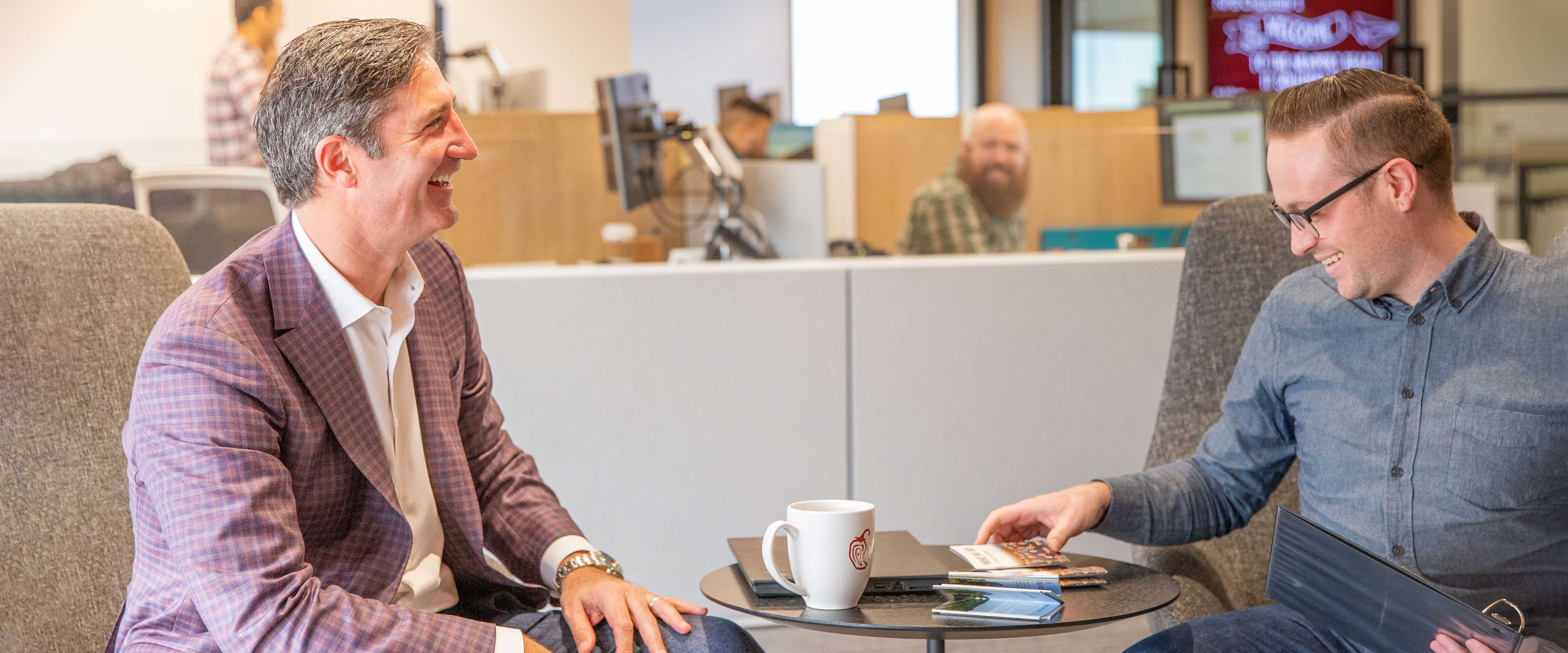 Chicago Booth alumnus Brian Niccol in his office at Chipotle with employees