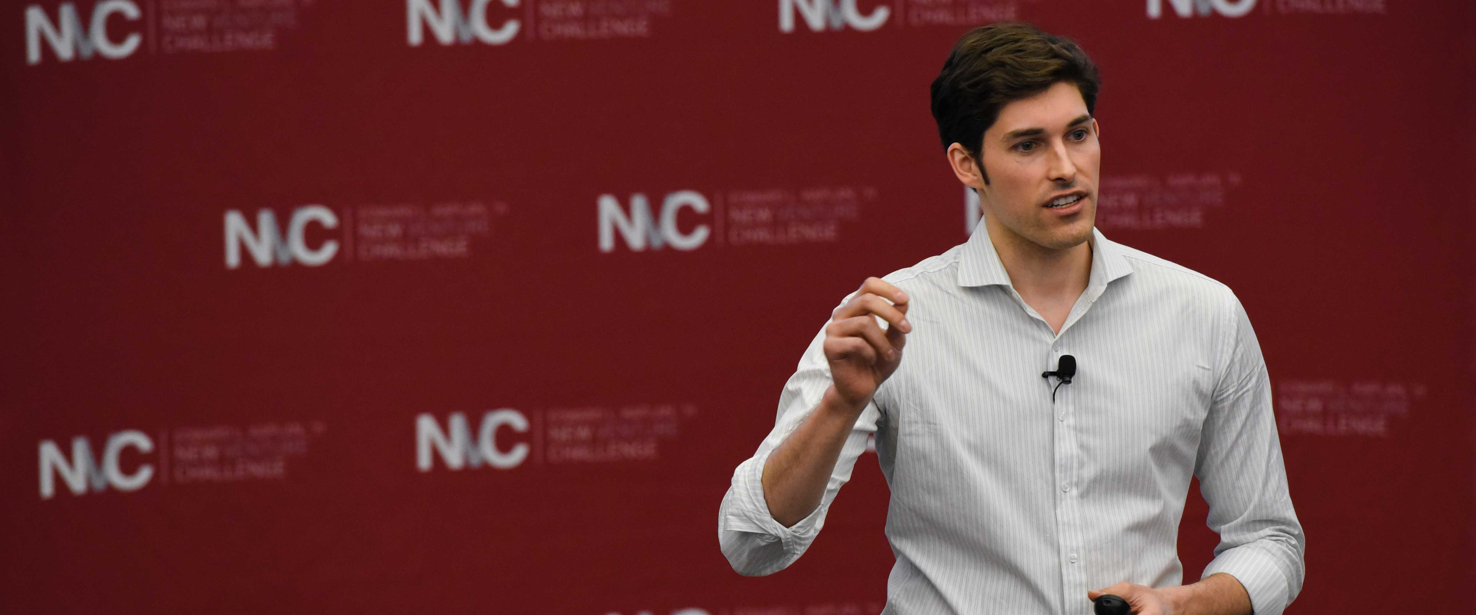 Man presenting at the New Venture Challenge 