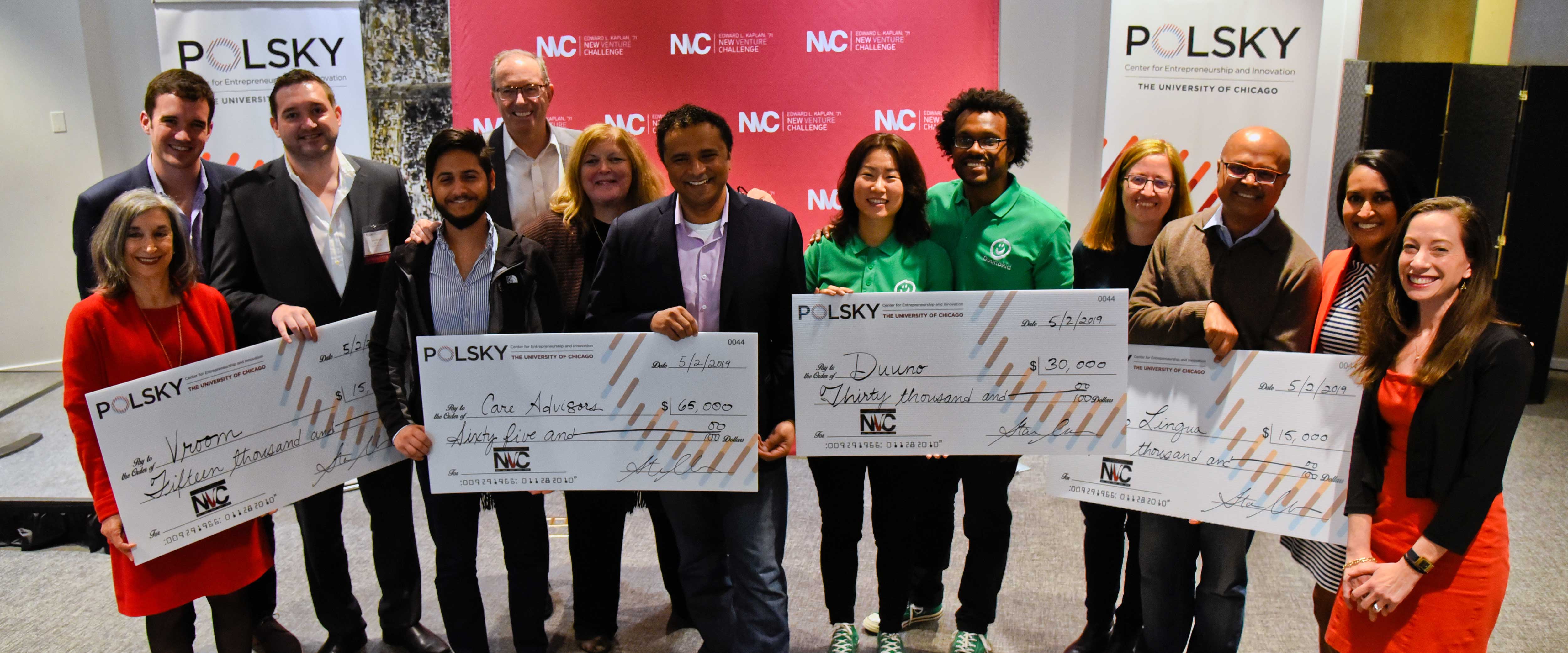 NVC Winners holding checks