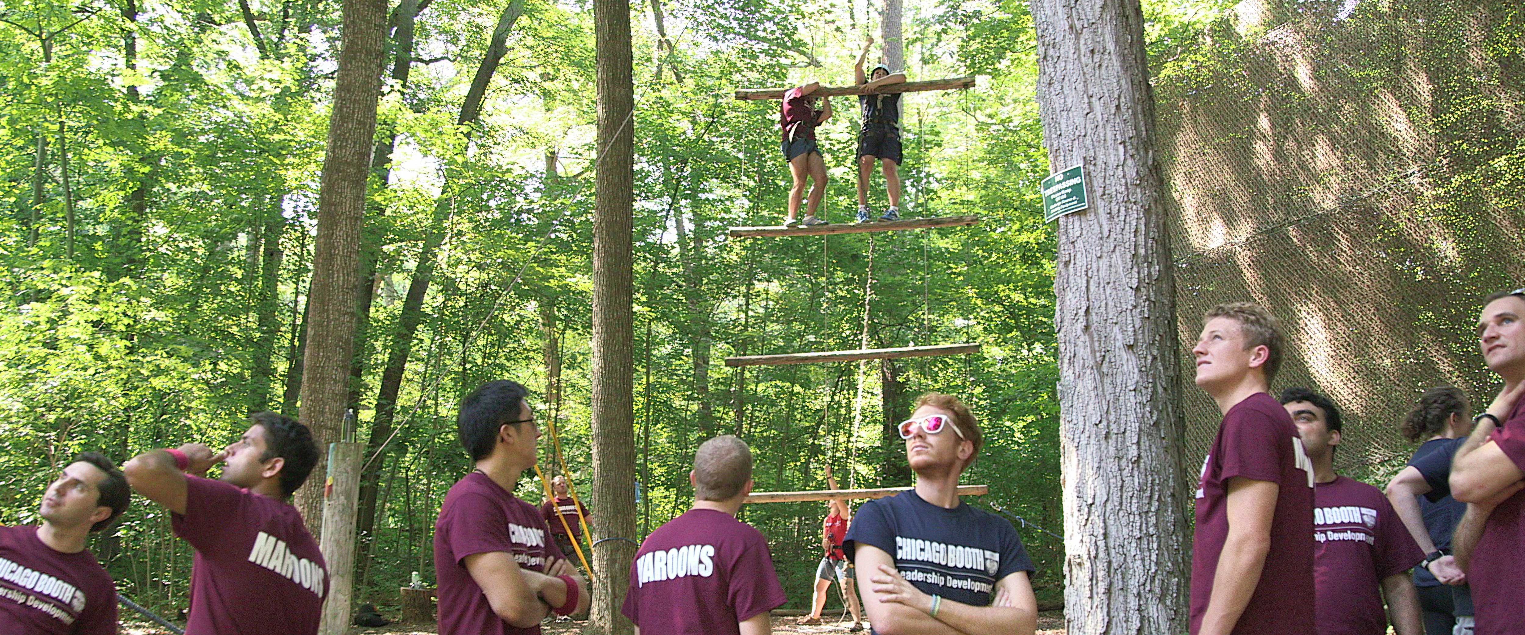 Students doing a ropes course activity